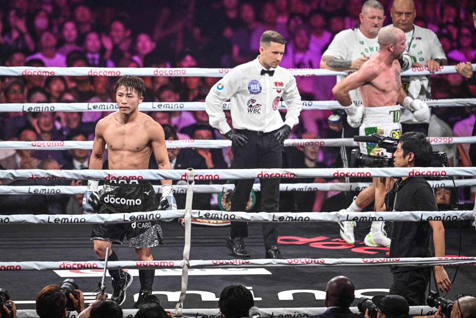 TJ Doheny clutches his back after his fight with Naoya Inoue is waved off