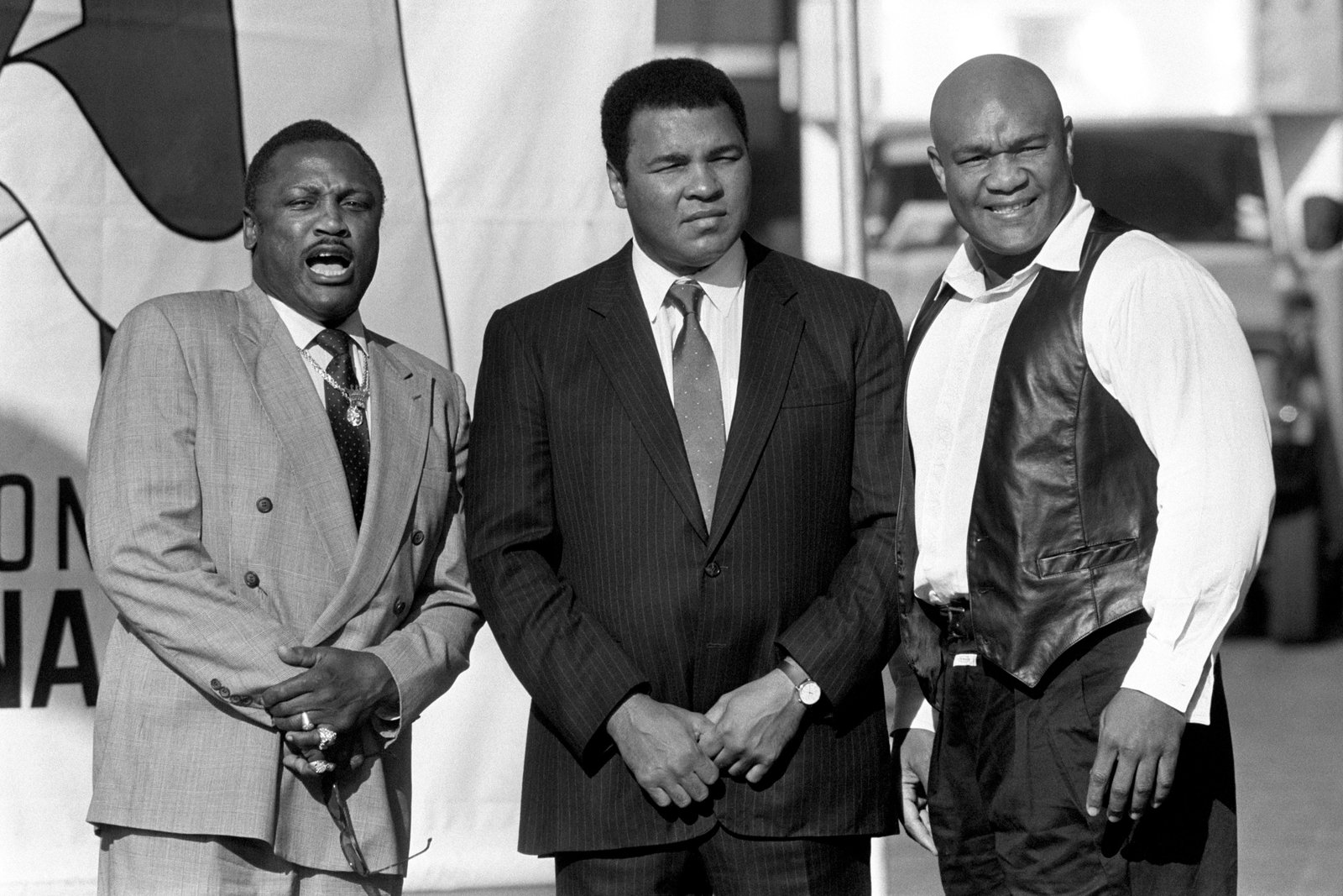 Former world heavyweight champions (left to right) Joe Frazier, Ali and George Foreman, pictured in October 1989 (PA)