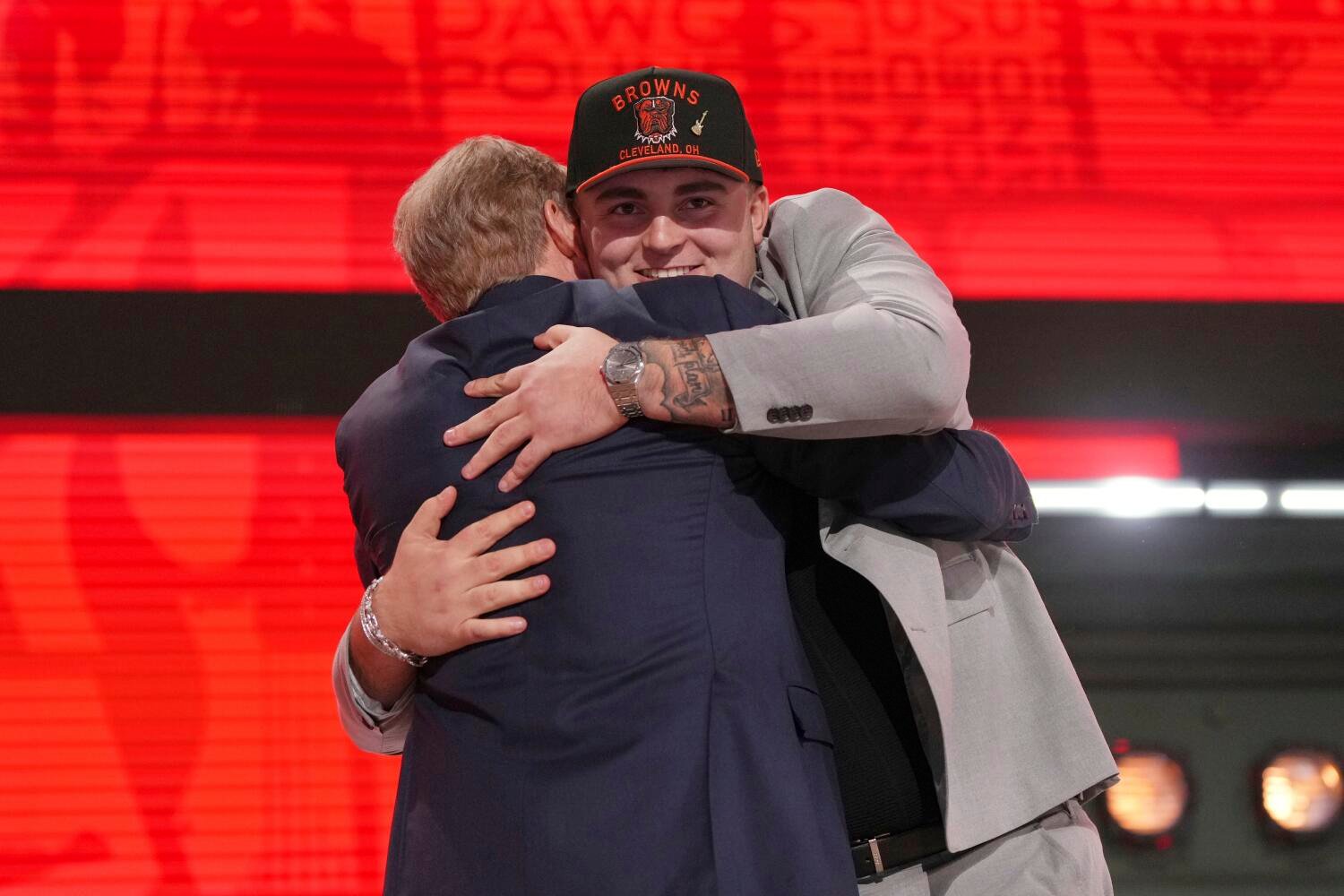 Michigan defensive lineman Mason Graham, who attended Servite High School in Anaheim, hugs NFL commissioner Roger Goodell.
