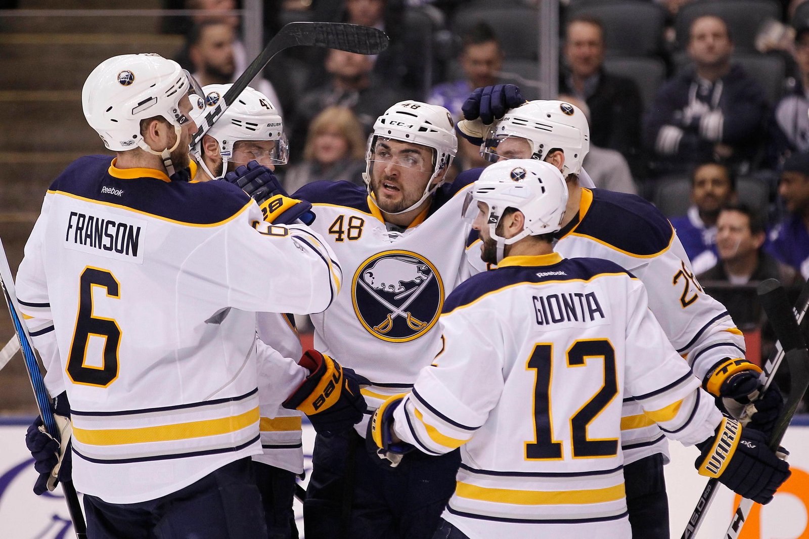 Jan 17, 2017; Toronto, Ontario, CAN; Buffalo Sabres forward William Carrier (48) celebrates his goal with defenseman Cody Franson (6) and forward Brian Gionta (12) against the Toronto Maple Leafs at the Air Canada Centre. Toronto defeated Buffalo 4-3. (John E. Sokolowski-Imagn Images)