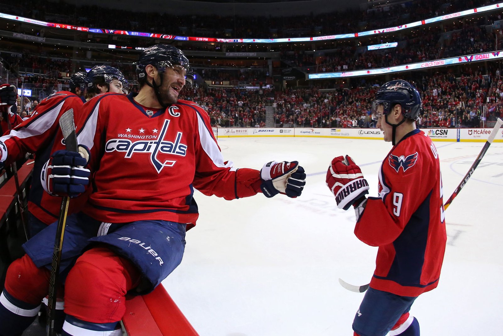Jan 23, 2017; Washington, DC, USA; Washington Capitals defenseman Dmitry Orlov (9) celebrates with Capitals left wing Alex Ovechkin (8) after scoring a goal against the Carolina Hurricanes in the first period at Verizon Center. The Capitals won 6-1. (Geoff Burke-Imagn Images)