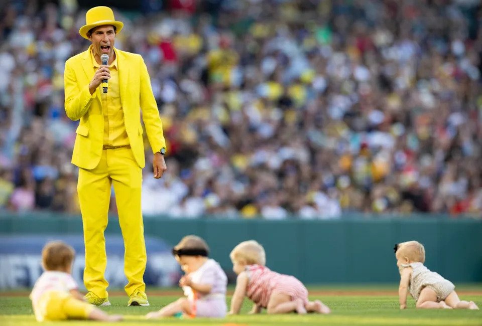 Savannah Bananas founder and owner Jesse Cole provides color commentary before a between innings baby race.