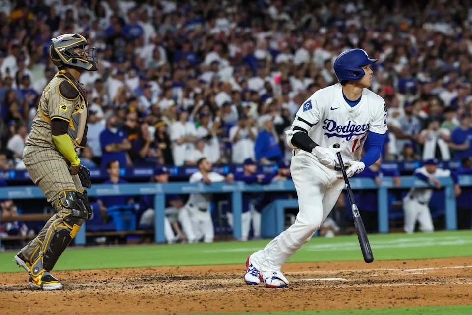 Shohei Ohtani hits a run-scoring single in the fourth inning against the Padres on Monday.