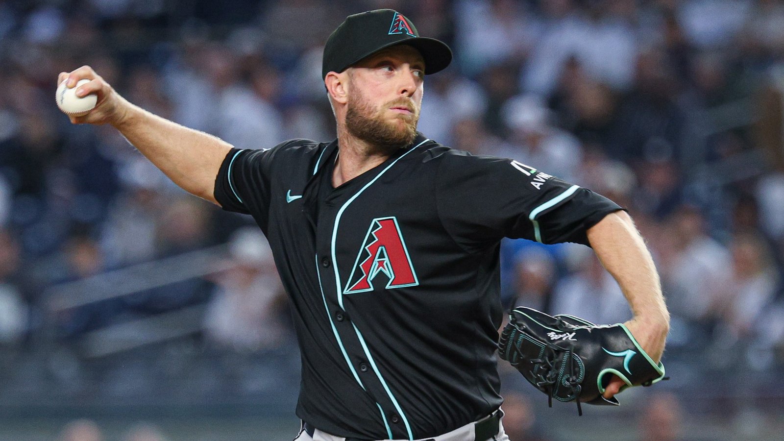 Apr 3, 2025; Bronx, New York, USA; Arizona Diamondbacks starting pitcher Merrill Kelly (29) delivers a pitch during the first inning against the New York Yankees at Yankee Stadium