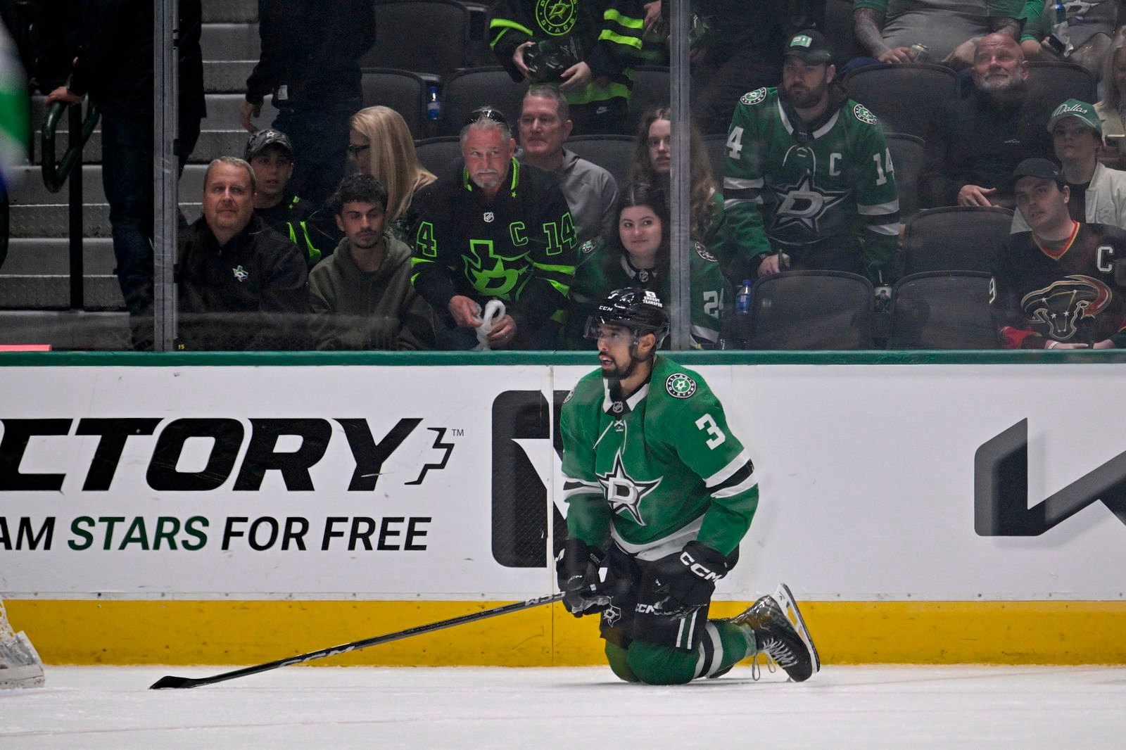 Apr 8, 2025; Dallas, Texas, USA; Dallas Stars defenseman Matt Dumba (3) looks on as the Vancouver Canucks celebrate the victory over the Stars in the overtime period at the American Airlines Center. Mandatory Credit: Jerome Miron-Imagn Images