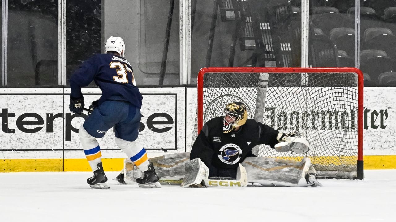 St. Louis Blues prospect, 2024 first-round pick Adam Jiricek (left) goes for a backhand shot during 3-on-3 action at development camp last week. (St. Louis Blues photo)