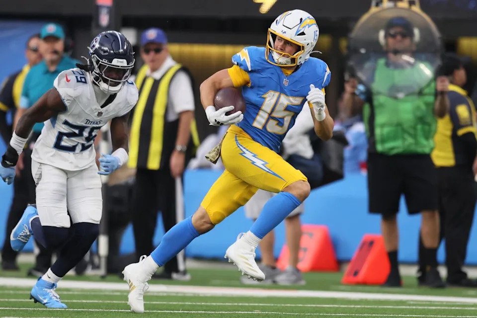 Chargers wide receiver Ladd McConkey runs with the ball after a catch against the Titans.