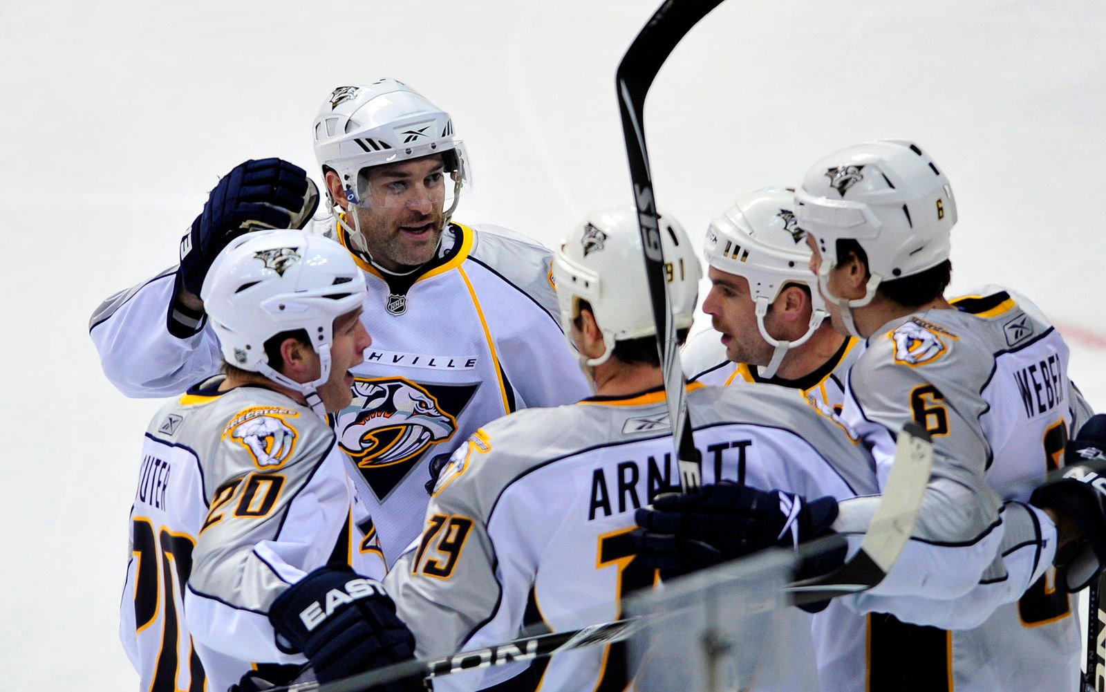 Nov 25, 2009; Denver, CO, USA; Nashville Predators right wing J.P. Dumont (71) (back-center) celebrates a goal with his teammates in the first period against the Colorado Avalanche at the Pepsi Center. Mandatory Credit: Ron Chenoy-Imagn Images