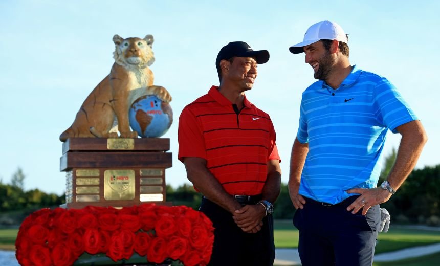 Woods and Scheffler pose for photos after Scheffler won the Hero World Challenge at Albany Golf Course in Nassau, Bahamas, in December 2023.