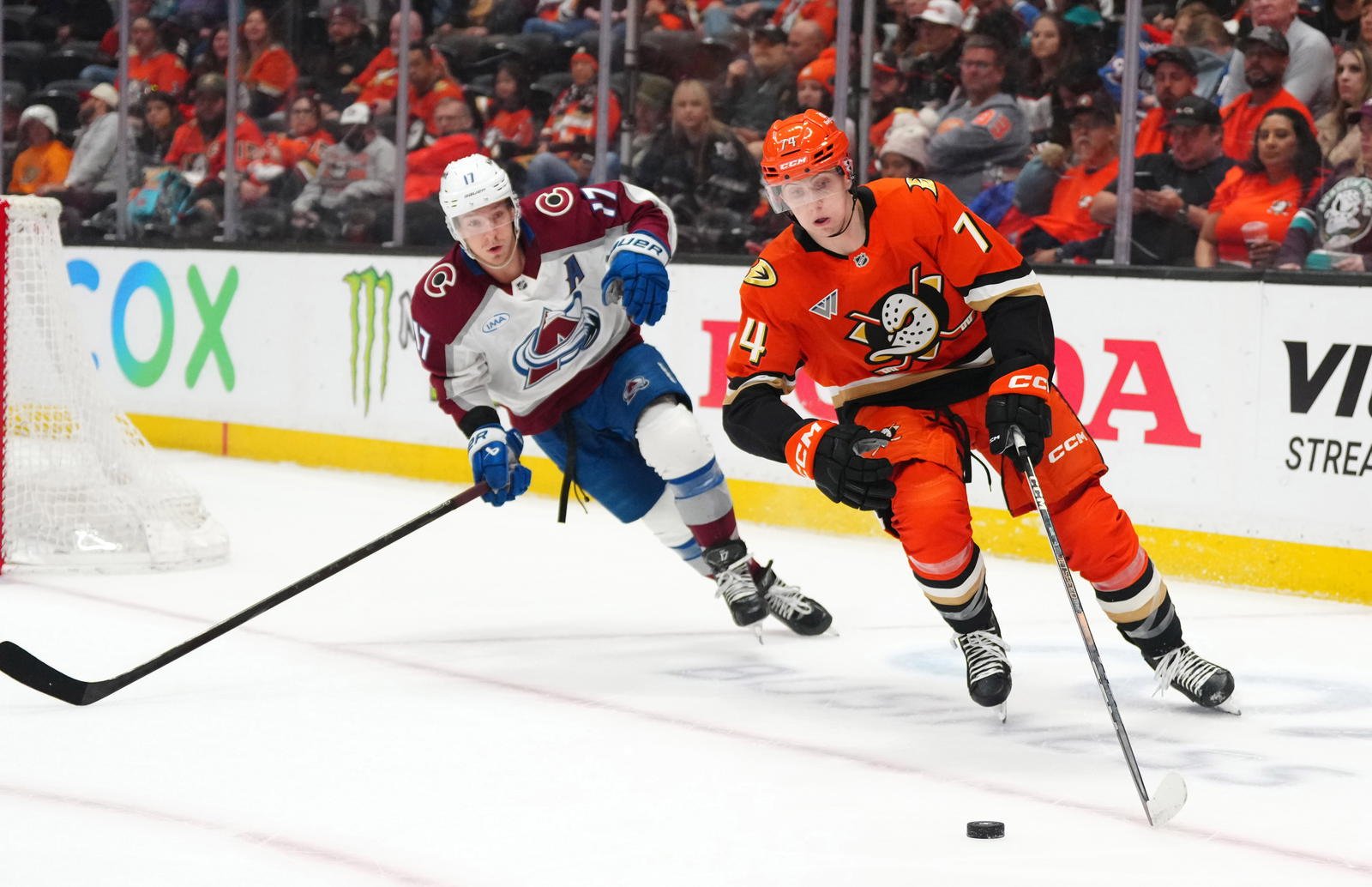 Apr 13, 2025; Anaheim, California, USA; Anaheim Ducks defenseman Ian Moore (74) pursues the puck against Colorado Avalanche center Parker Kelly (17) in the first period at Honda Center. Mandatory Credit: Kirby Lee-Imagn Images