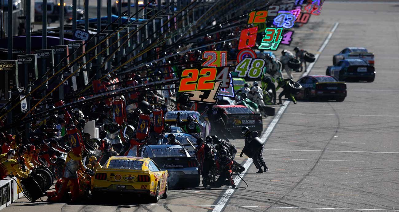 Pit road at Kansas Speedway is a busy place as the Cup Series field stops for service