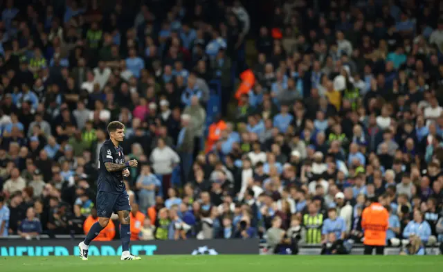 Giovanni Di Lorenzo of Napoli leaves the pitch after being shown a red card for a foul on Erling Haaland of Manchester City (not pictured) during the UEFA Champions League 2025/26 League Phase MD1 match between Manchester City and SSC Napoli at City of Manchester Stadium on September 18, 2025 in Manchester, England.
