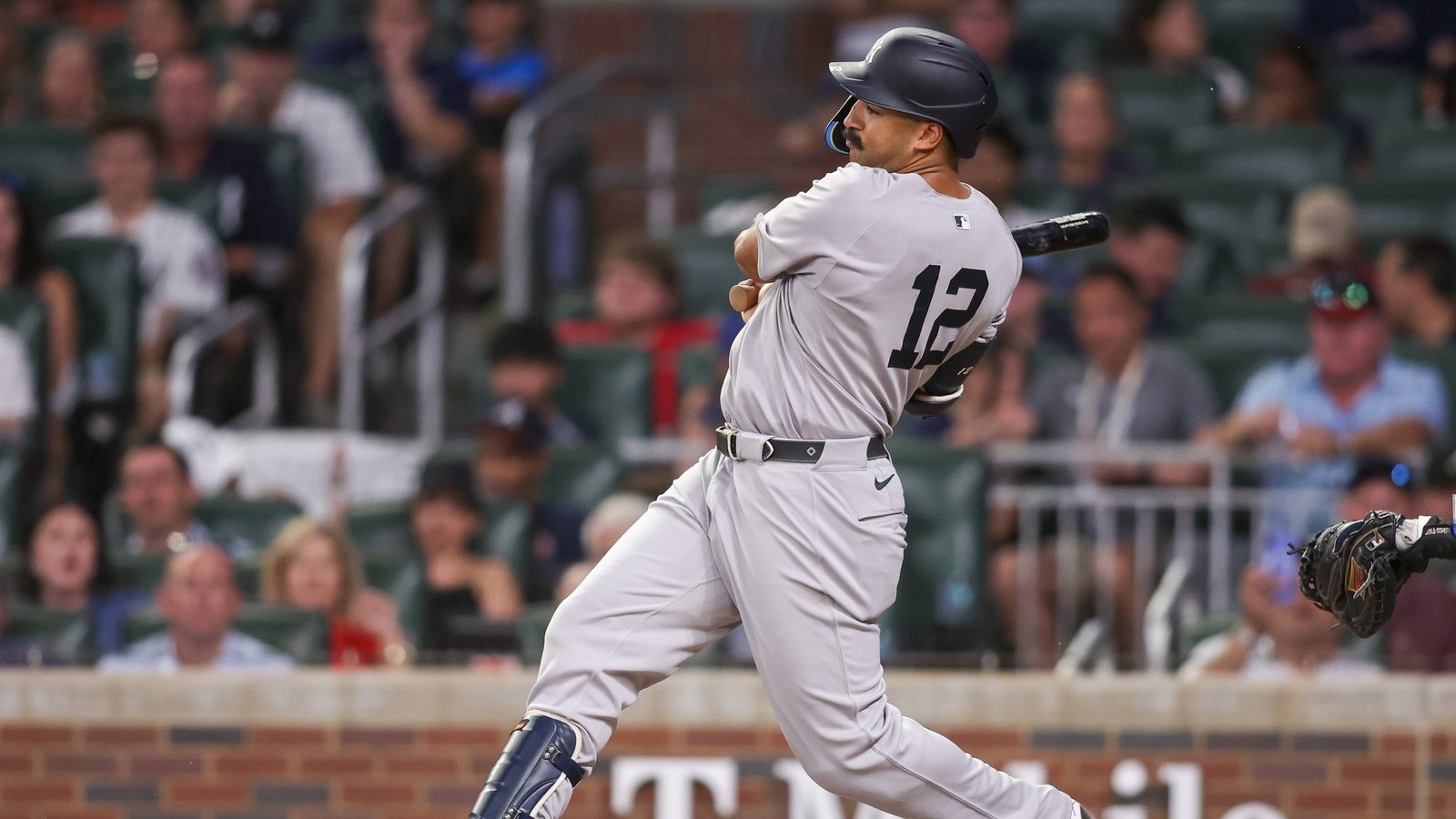Jul 19, 2025; Atlanta, Georgia, USA; New York Yankees center fielder Trent Grisham (12) drives in a run on a fielder’s choice against the Atlanta Braves in the sixth inning at Truist Park.