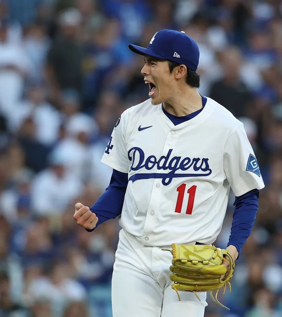 Dodgers pitcher Roki Sasaki reacts after striking out a batter in the ninth inning of Game 4 of the NLDS at Dodger Stadium.