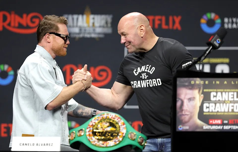 LAS VEGAS, NEVADA - JUNE 27: Undisputed super middleweight champion Canelo Alvarez (L) greets UFC president Dana White during a news conference at T-Mobile Arena on June 27, 2025 in Las Vegas, Nevada. Alvarez is scheduled to defend his titles against undefeated boxer Terence Crawford on September 13, 2025, at Allegiant Stadium in Las Vegas. White is part of a team promoting the event. (Photo by Steve Marcus/Getty Images)