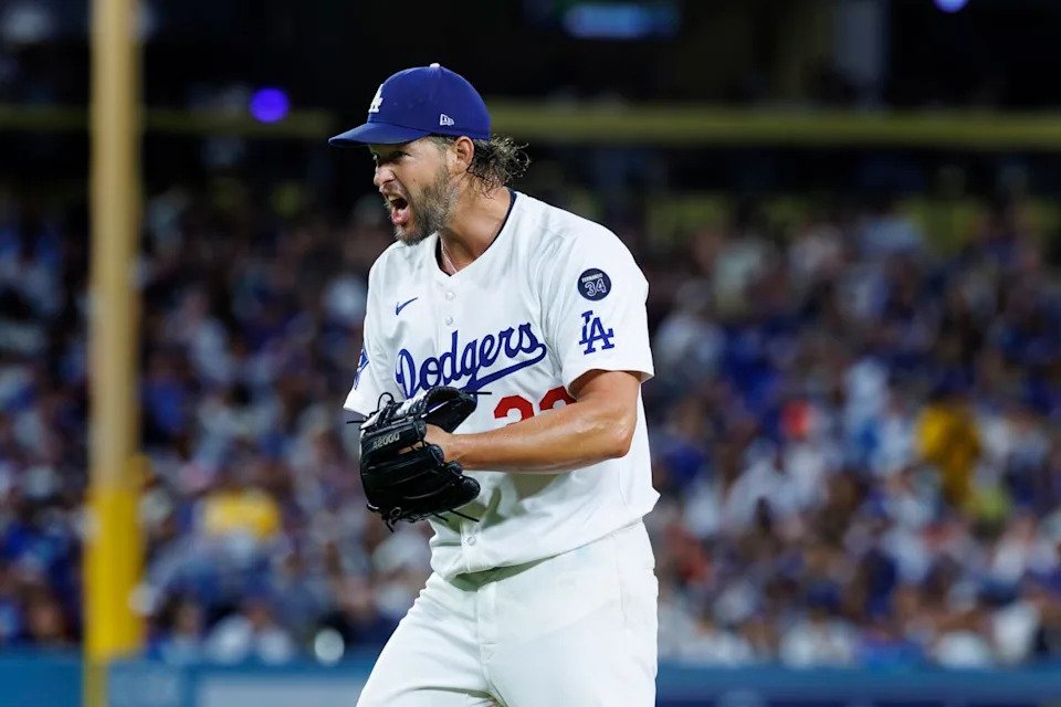 Dodgers pitcher Clayton Kershaw celebrates after getting San Francisco's Jerar Encarnacion to hit into a double play.