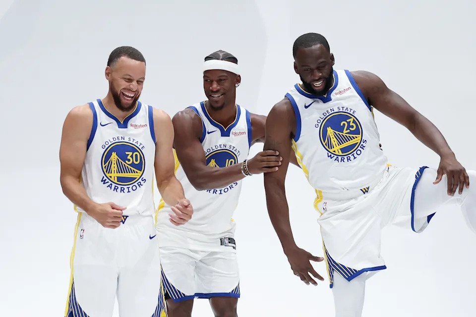 SAN FRANCISCO, CALIFORNIA - SEPTEMBER 29: Jimmy Butler III #10, Stephen Curry #30, and Draymond Green #23 of the Golden State Warriors joke around during the Golden State Warriors' media day at Chase Center on September 29, 2025 in San Francisco, California.  NOTE TO USER: User expressly acknowledges and agrees that, by downloading and/or using this photograph, user is consenting to the terms and conditions of the Getty Images License Agreement.  (Photo by Ezra Shaw/Getty Images)