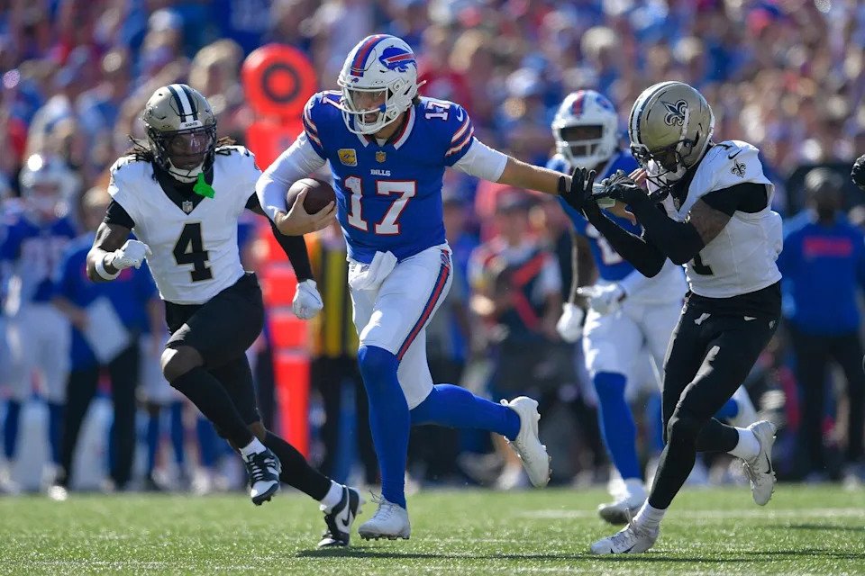 Buffalo Bills quarterback Josh Allen stiff arms New Orleans Saints cornerback Alontae Taylor on Sept. 28.