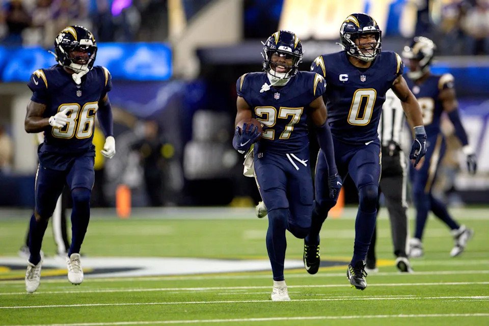 Chargers safety R.J. Mickens (27) celebrates after intercepting a pass from Vikings quarterback Carson Wentz.