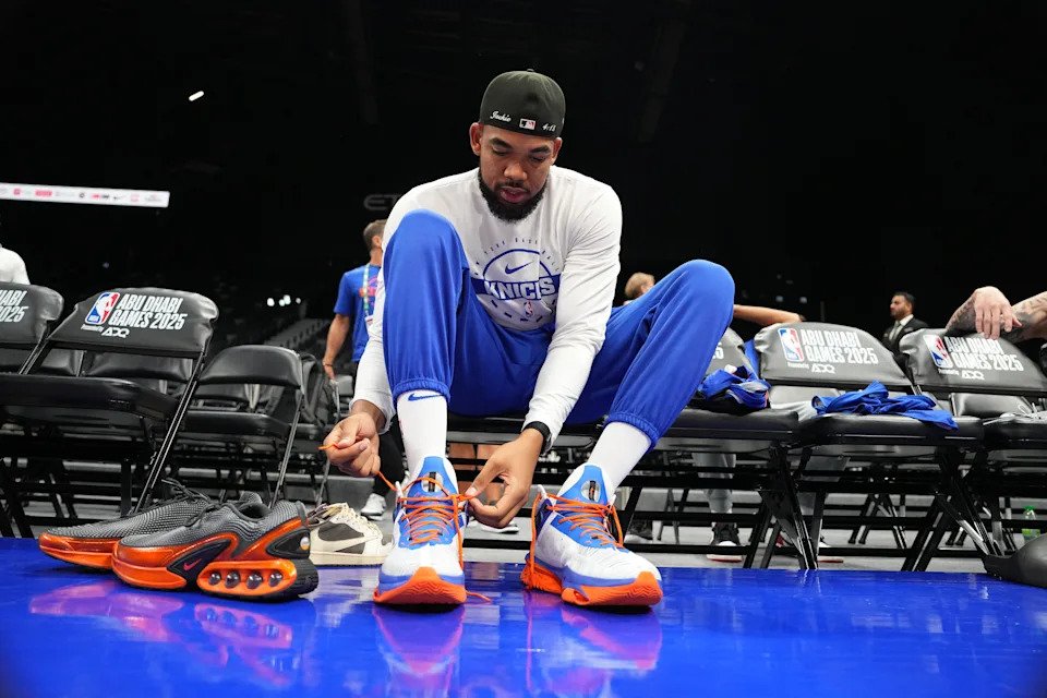 ABU DHABI, UAE - OCTOBER 1: Karl-Anthony Towns #32 of the New York Knicks laces up during practice and media availability as part of 2025 NBA Global Games Abu Dhabi at Etihad Arena on October 1, 2025 in Abu Dhabi, The United Arab Emirates. NOTE TO USER: User expressly acknowledges and agrees that, by downloading and/or using this Photograph, user is consenting to the terms and conditions of the Getty Images License Agreement. Mandatory Copyright Notice: Copyright 2025 NBAE (Photo by Jesse D. Garrabrant/NBAE via Getty Images)