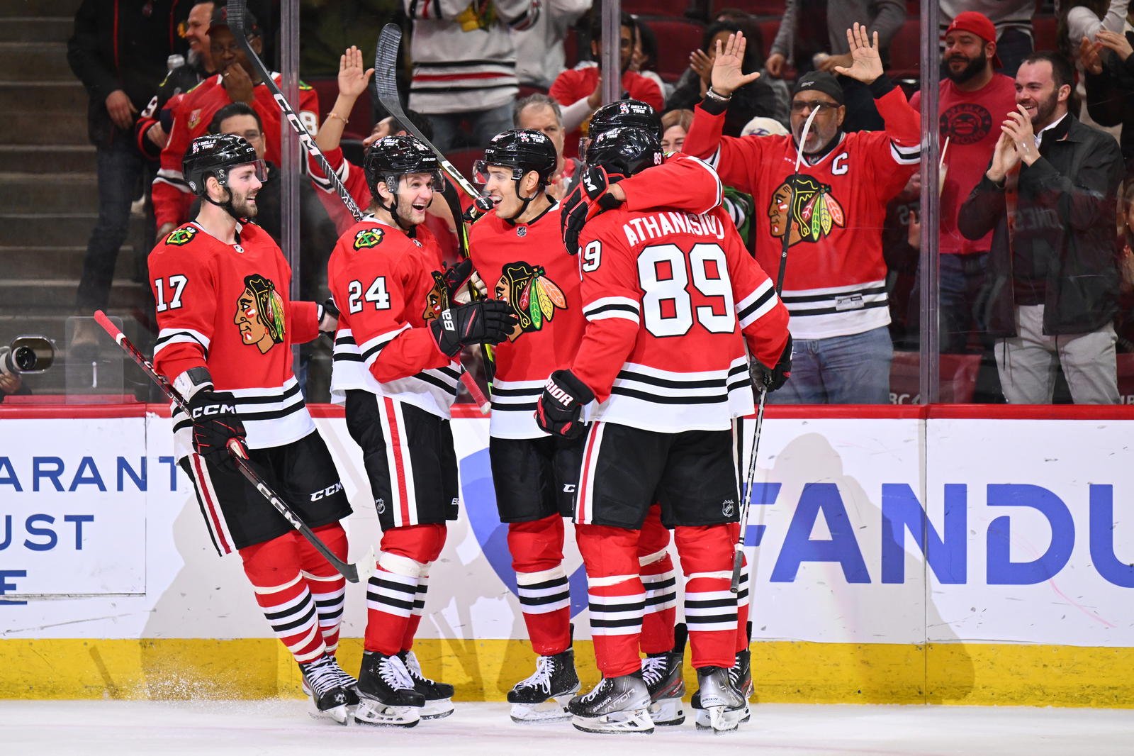 Mar 6, 2023; Chicago, Illinois, USA; Chicago Blackhawks forward Jason Dickinson (17), forward Anders Bjork (24), defenseman Caleb Jones (82) and forward Andreas Athanasiou (89) celebrate with defenseman Seth Jones (4) after Seth Jones scored his second goal of the second period against the Ottawa Senators at United Center. Mandatory Credit: Jamie Sabau-Imagn Images