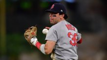 Jun 24, 2025; Anaheim, California, USA; Boston Red Sox second baseman Marcelo Mayer (39) loses control of the ball for the throw to first against Los Angeles Angels center fielder Jo Adell (7). during the seventh inning at Angel Stadium. Mandatory Credit: Gary A. Vasquez-Imagn Images