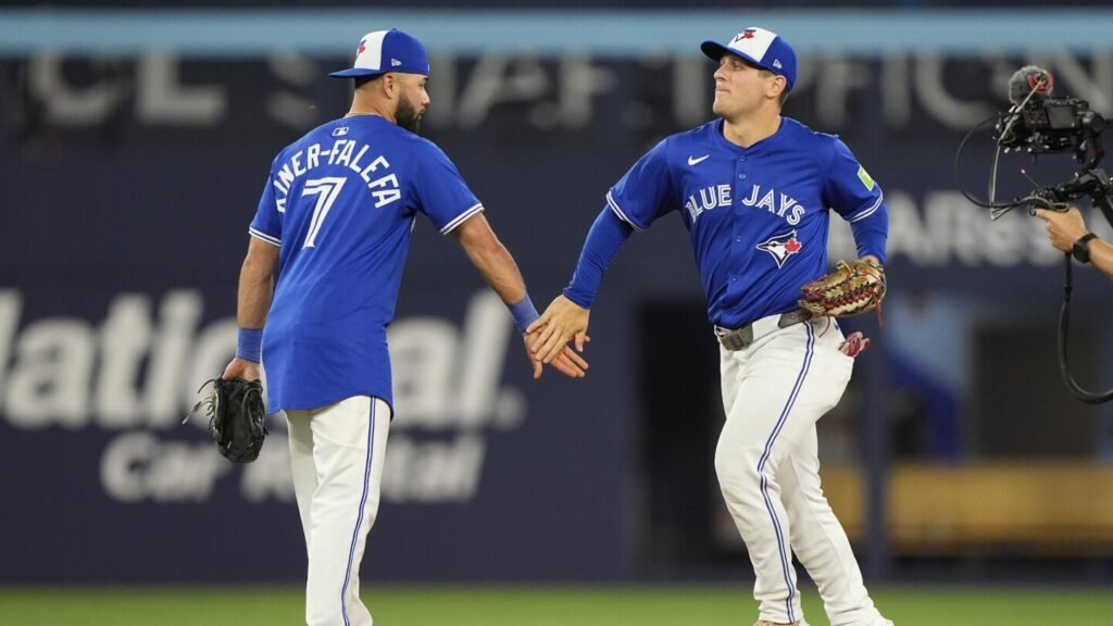 Hat trick: The Blue Jays think their 1992 World Series-style caps are a lucky charm