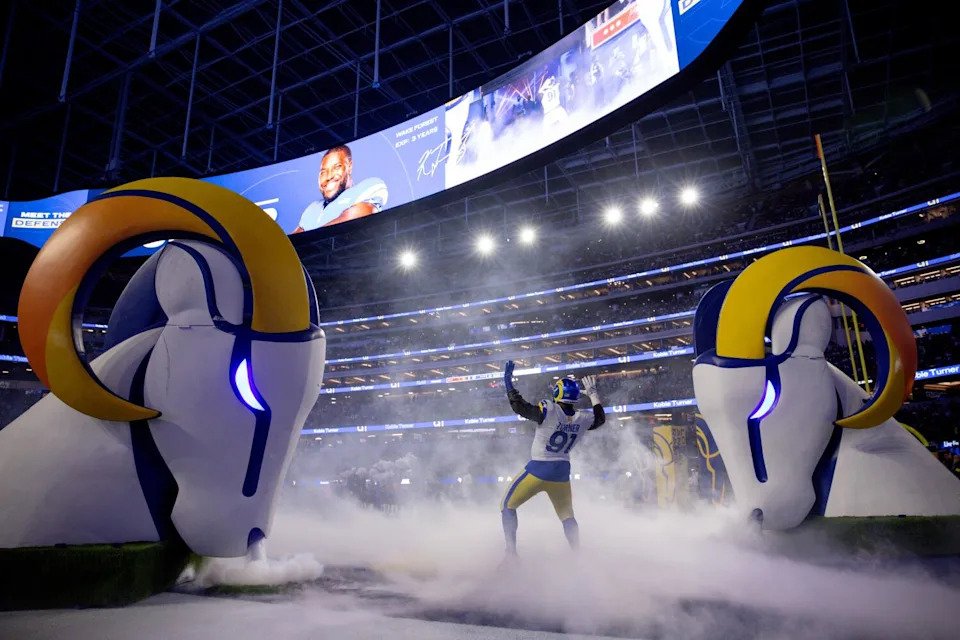 Rams defensive end Kobie Turner reacts during player introductions before facing the Buccaneers.