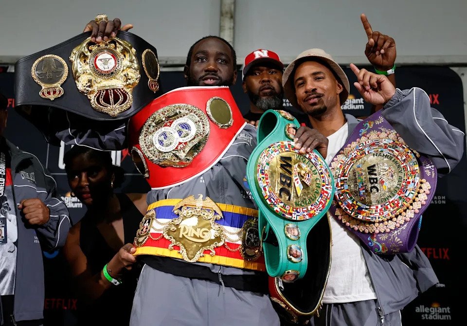 Crawford with all the major super-middleweight titles, including The Ring’s belt (around his waist) and the green-and-gold WBC strap (Getty)