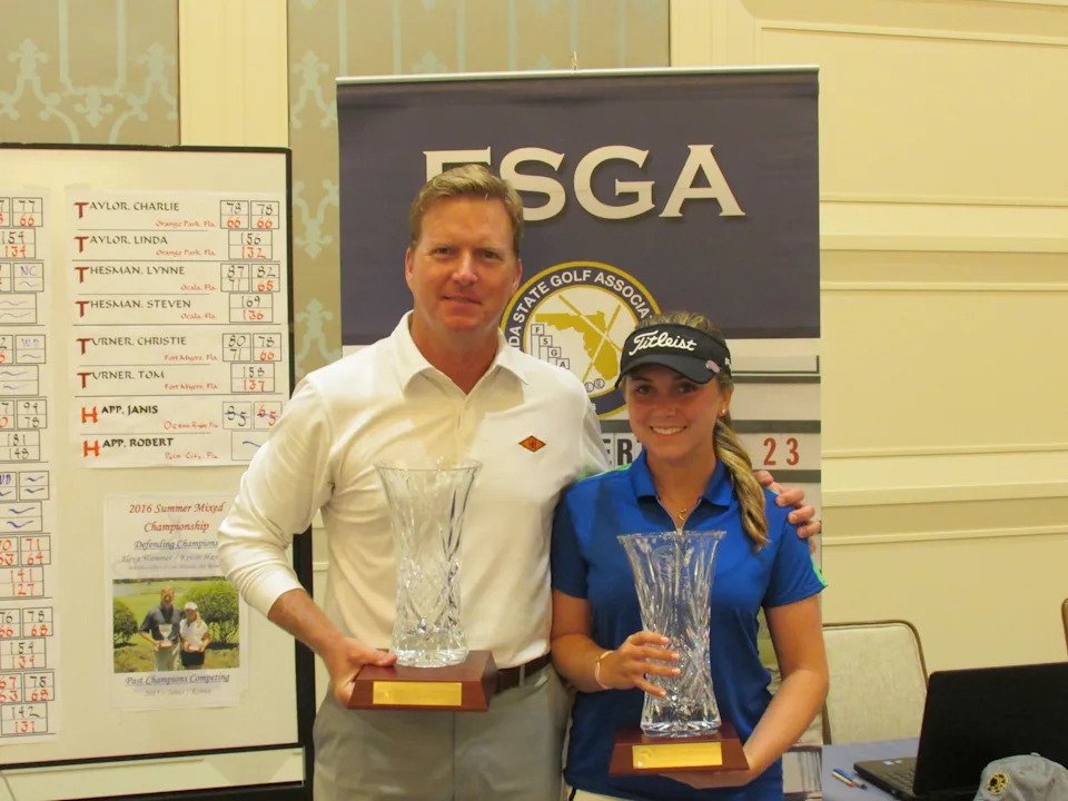 Kevin Hammer and his daughter, Alexa, pose after they won a FSGA event together.