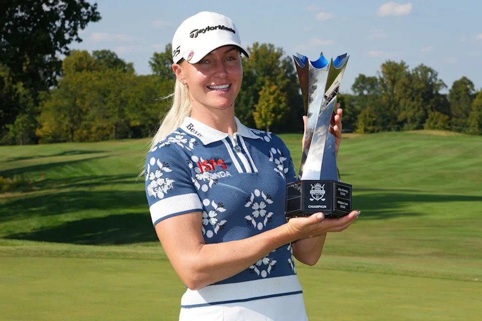Charley Hull of England poses with the trophy after winning the Kroger Queen City Championship presented by P&G 2025 at TPC River's Bend on September 14, 2025 in Cincinnati, Ohio.