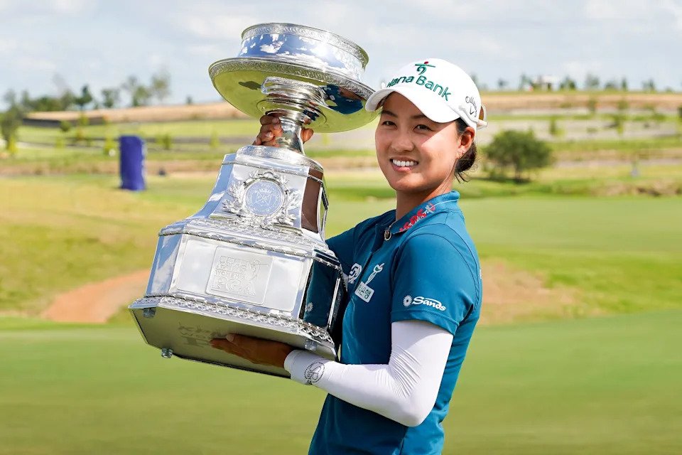 Minjee Lee poses with the trophy after winning the 2025 KPMG Women's PGA Championship.