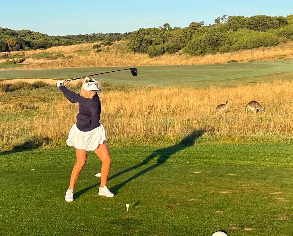 Averee Dovsek hits a tee shot as kangaroos saunter in the rough at St. Andrews Beach Golf Club in Victoria/Australia (Jason Lusk/Golfweek)