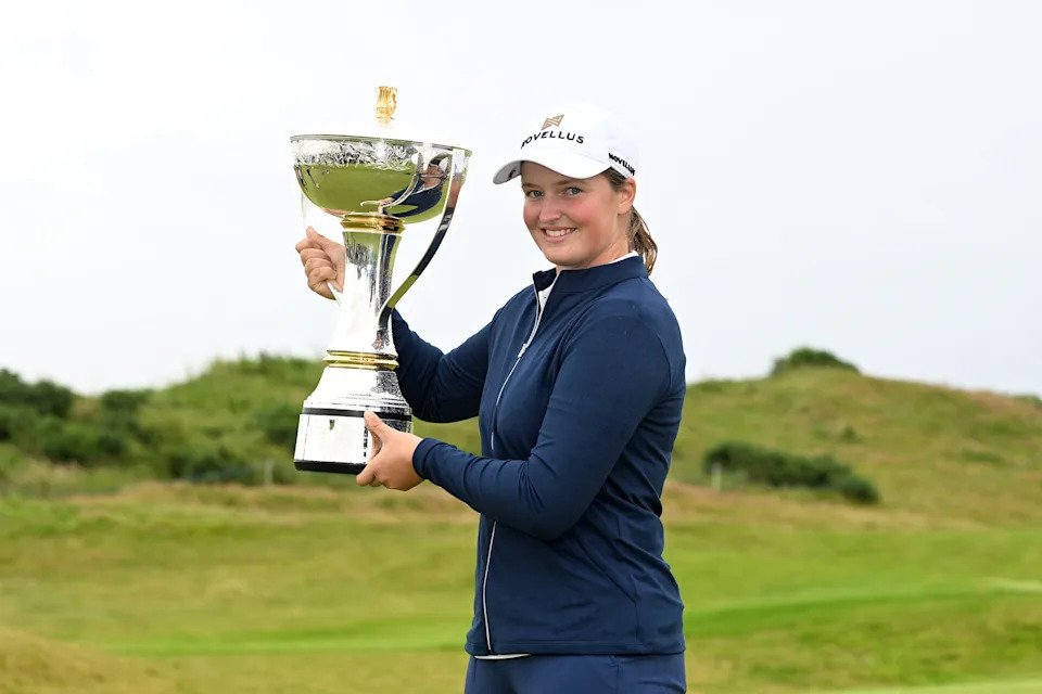 Lottie Woad of England poses with the trophy following victory of the ISPS HANDA Women's Scottish Open following the final round of the ISPS HANDA Women's Scottish Open 2025 at Dundonald Links Golf Course on July 27, 2025 in Troon, Scotland.