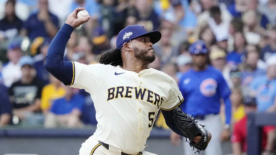 Oct 4, 2025; Milwaukee, Wisconsin, USA; Milwaukee Brewers starting pitcher Freddy Peralta (51) pitches against the Chicago Cubs during the second inning of game one of the NLDS round for the 2025 MLB playoffs at American Family Field. 