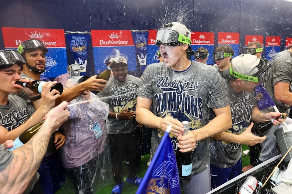 Dodgers’ Ohtani celebrates with teammates in the locker room after defeating the Blue Jays. Getty Images