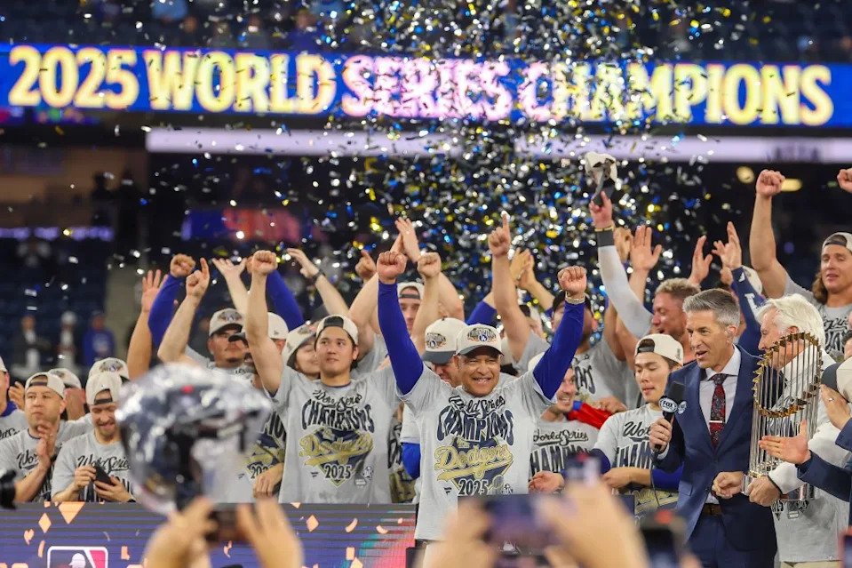 (C) Dodgers’ Dave Roberts celebrates with his team after defeating the Blue Jays 5–4 to win the 2025 World Series. Getty Images