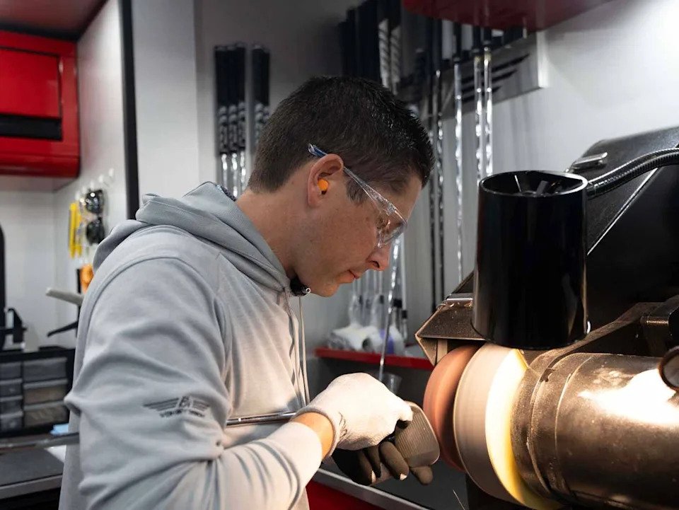 Aaron Dill grinds a Vokey wedge.