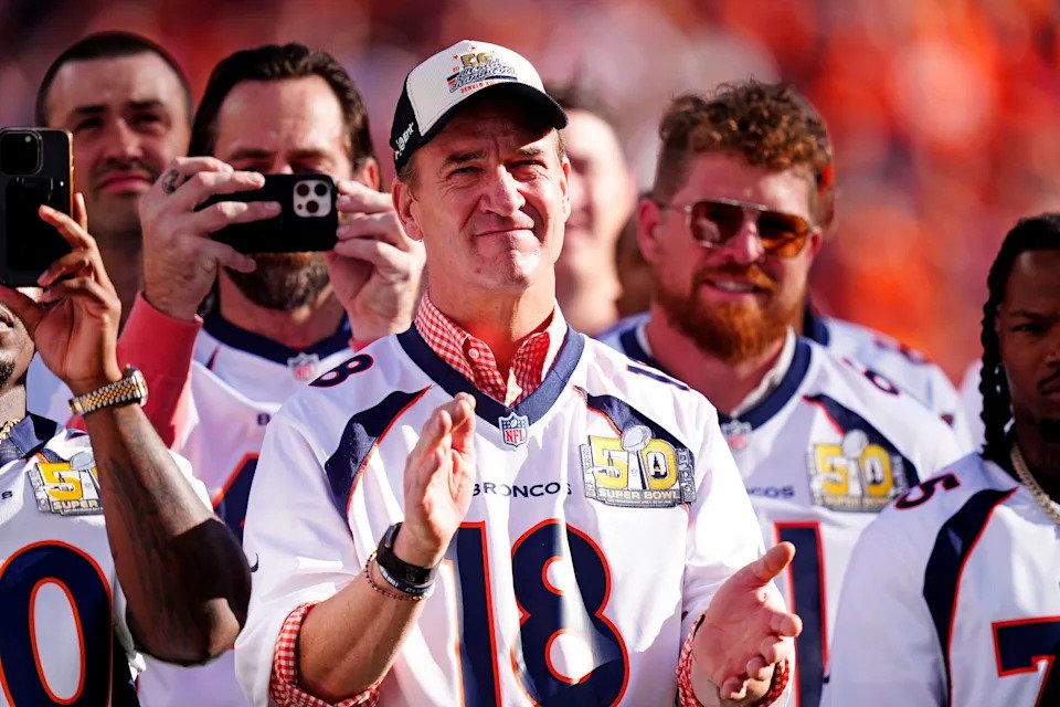 Oct 19, 2025; Denver, Colorado, USA; Peyton Manning looks on during the game between the New York Giants and the Denver Broncos at Empower Field at Mile High. Mandatory Credit: Ron Chenoy-Imagn Images