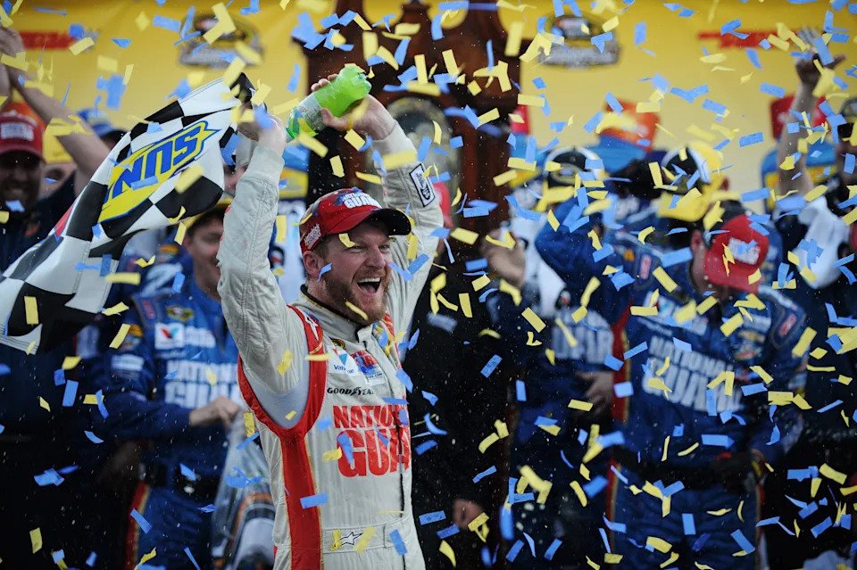 MARTINSVILLE, VA - OCTOBER 26: Dale Earnhardt Jr., driver of the #88 National Guard Chevrolet, celebrates in Victory Lane after winning during the NASCAR Sprint Cup Series Goody's Headache Relief Shot 500 at Martinsville Speedway on October 26, 2014 in Martinsville, Virginia. (Photo by Jonathan Moore/Getty Images)