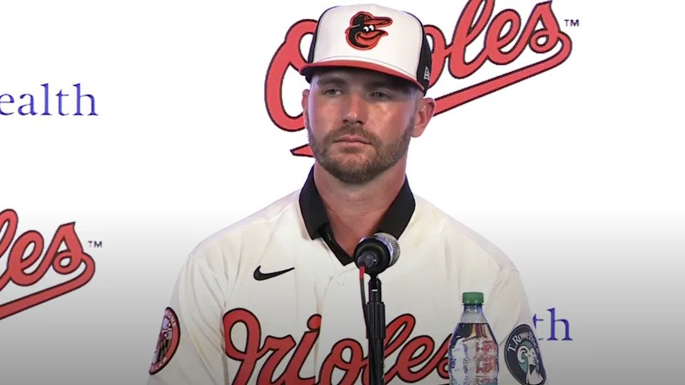 Pete Alonso wears a Baltimore Orioles uniform for the first time during his introductory press conference on December 12, 2025