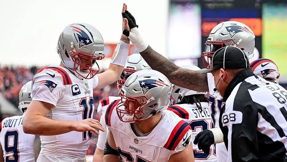 New England Patriots quarterback Drake Maye celebrates after scoring a touchdown against the Denver Broncos in the AFC Championship game in 2026