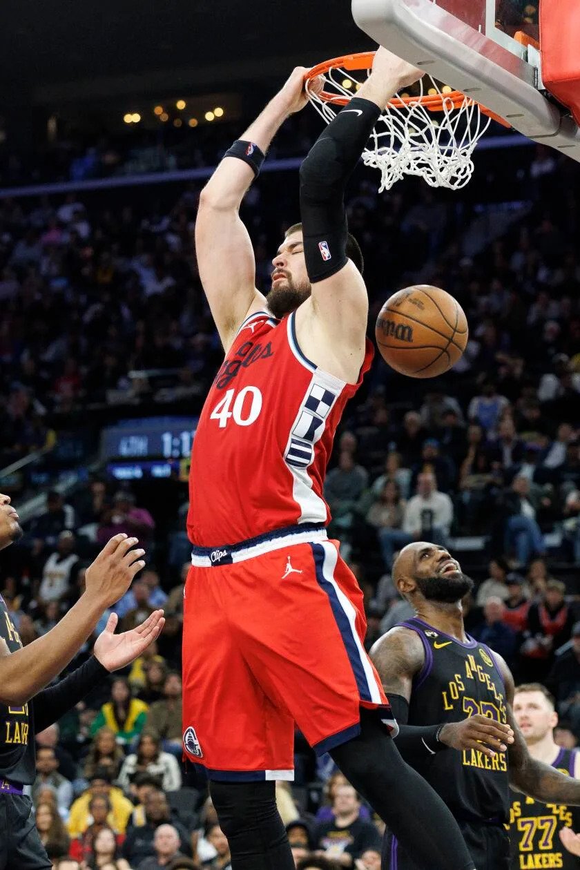 Clippers center Ivica Zubac scores on a reverse dunk in the fourth quarter of the Clippers' 112-104 win.