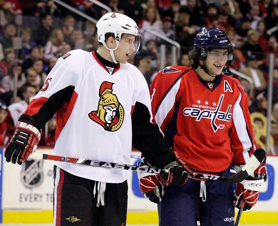 Jan. 1, 2008; Washington, DC, USA; Ottawa Senators left wing Dany Heatley (15) and Washington Capitals left wing Alexander Ovechkin (8) share a moment during the Capitals 6-3 win at Verizon Center in Washington, DC. Mandatory Credit: Geoff Burke-Imagn Images