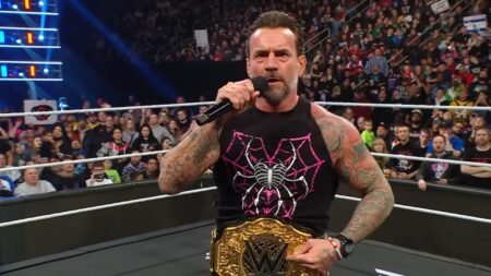 CM Punk uses the World Heavyweight Championship belt to honor his idol at WWE HQ