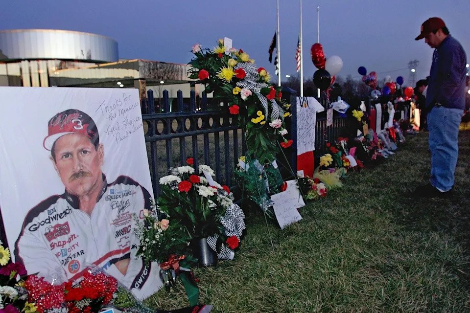 A portrait of NASCAR driver Dale Earnhardt adorns a memorial outside Earnhardt's corporate headquarters.