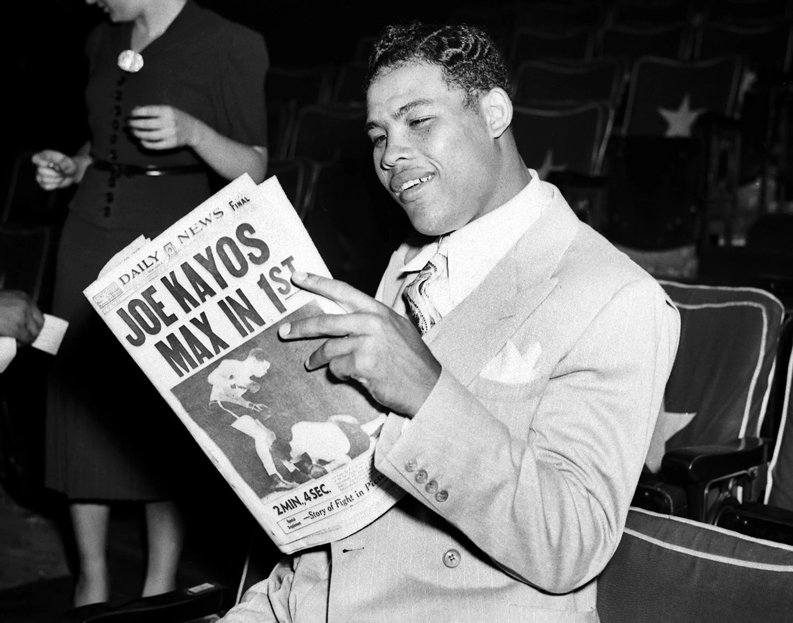 NEW YORK - JUNE 23, 1938:  Day after Joe Louis versus Max Schmeling II fight. The usually immobile countenance of the champ yields to a smile as Joe reads some highly interesting literature, copiously illustrated. He sees himself as others saw him. (Photo by NY Daily News Archive via Getty Images)