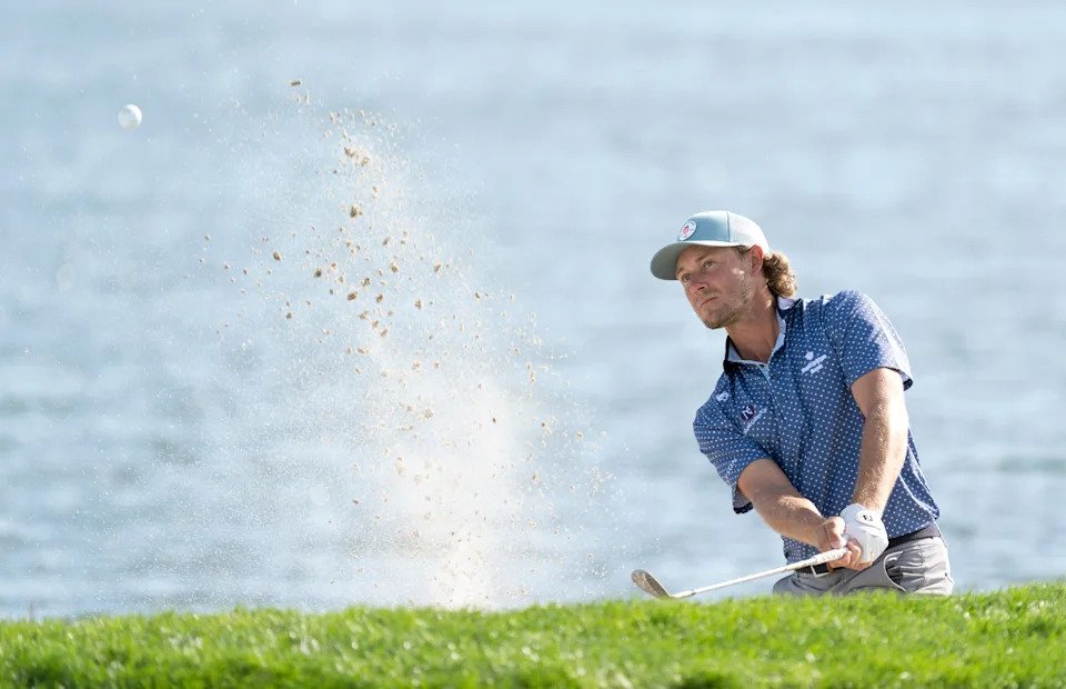 Austin Smotherman blasts out of the sand on the 18th hole during the second round of the Cognizant Classic in the Palm Beaches on February 27, 2026, in Palm Beach Gardens, Florida.