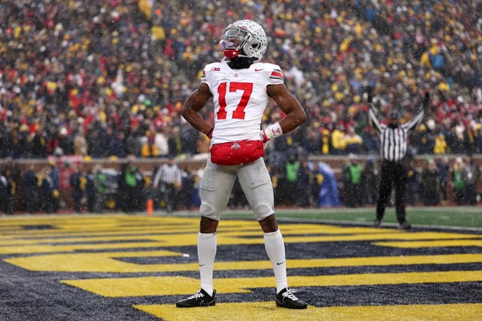 Carnell Tate of the Ohio State Buckeyes celebrates after a touchdown during the third quarter against the Michigan Wolverines at Michigan Stadium on November 29, 2025 in Ann Arbor, Michigan. Getty Images