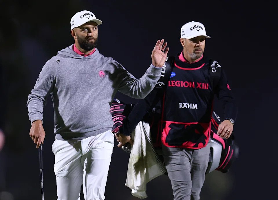 Jon Rahm of Legion XIII and his caddie walk onto the 12th green on day three of LIV Golf Riyadh at Riyadh Golf Club on February 06, 2026 in Jeddah, Saudi Arabia.